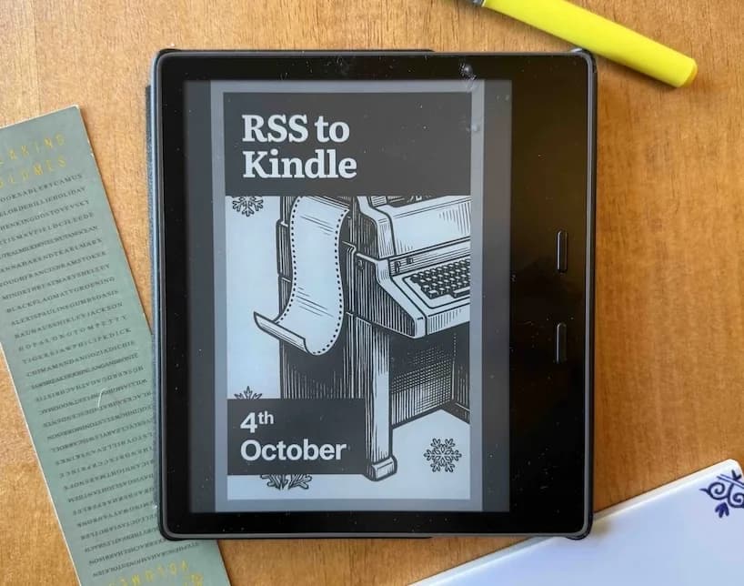 A Kindle on a desk showing the RSS to Kindle daily digest cover